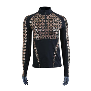 Black women's long sleeve 1/4 zip mock top by Seirus, featuring metallic gold geometric patterns on the chest and sleeves.