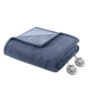 Blue plush heated blanket by Serta, folded, with two white controllers.