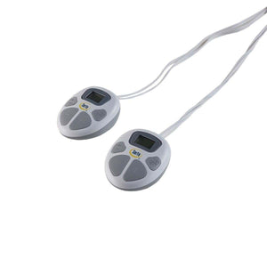 Heated blanket by Serta, featuring two white and gray digital controllers with cords, angled on a white surface.