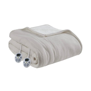 Light beige heated fleece to sherpa blanket by Serta, folded with two white controllers visible.