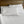 White King cotton sateen sheet set by Shavel, including multiple pillows, on a bed with a wooden headboard.
