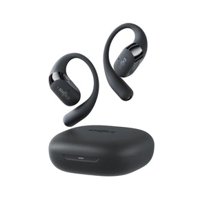 Matte black open-ear earbuds by Shokz, shown floating above their charging case.