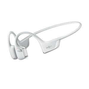 White bone conduction headphones by Shokz, featuring a flexible neckband and ear hooks, seen from an angled side.
