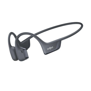 Dark gray bone conduction headphone by Shokz, shown in a side view with an open-ear design.