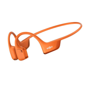 Orange bone conduction headphones by Shokz, with visible logo, in an angled view.