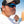 Matte black frame sunglasses with blue mirror lenses by Smith Optics, featuring the 'SMITH' logo, worn by a man fishing.