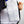 White mesh phase change cooling vest by TechKewl, revealing square cooling packs inside with a hand holding the zipper.
