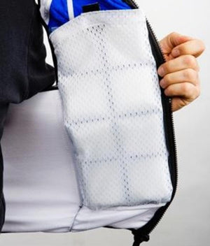 White mesh phase change cooling vest by TechKewl, revealing square cooling packs inside with a hand holding the zipper.