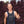 Black evaporative cooling tank top by HyperKewl with quilted front panel and blue trim, worn by a smiling man.