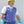 Blue phase change cooling vest by TechKewl, zippered with adjustable side straps, worn by a man in a hard hat and gloves.