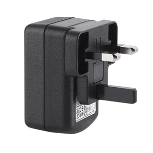 Black plastic USB power adapter by Therm-ic with a UK plug and textured casing, viewed from the side.