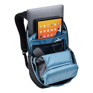 Black 20L laptop backpack by Thule, open showing a laptop, tablet, and blue patterned inner compartments.