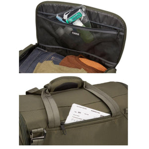Olive green duffel bag by Thule, open to show organized interior with clothing and toiletries, and an exterior pocket holding a boarding pass.