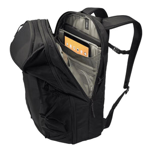 Black 30L laptop backpack by Thule, open showing a tablet and laptop in internal organizer pockets.