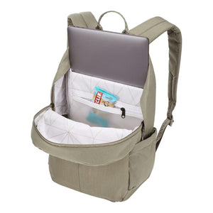 Open sage green laptop backpack by Thule, revealing a laptop, Clif bar, and geometric pattern lining.