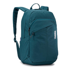 Dark teal laptop backpack by Thule featuring zippered front pockets, a side slip pocket, and the white brand logo.