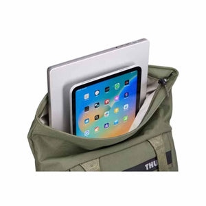Olive green tote bag by Thule, open and holding a silver laptop and tablet, with 'THU' on a strap.