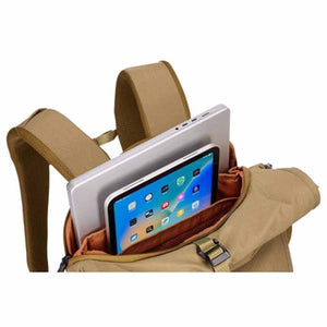 Tan laptop backpack by Thule, open to reveal a silver laptop, tablet, and orange lining inside.