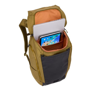 Olive green 28L commute backpack by Thule, shown open from above, storing a laptop and tablet in its orange-lined interior with a black front pocket.