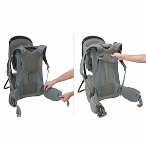 Grey-green baby backpack by Thule, shown in two views with hands adjusting the hip belt and back panel.