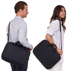 Black 16-inch laptop and tablet attache by Thule, shown carried by a man cross-body and a woman by the top handle.