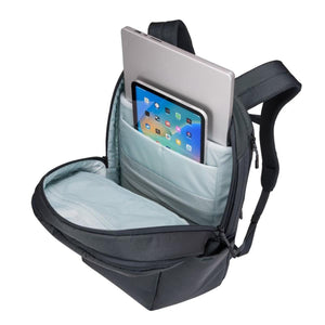 Dark grey 27L backpack by Thule, open to reveal a laptop, a tablet, and a mesh pocket inside the light blue compartment.