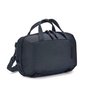 Dark gray crossbody bag by Thule with top handles, dual zipper pulls, and a subtle embossed logo on the side.