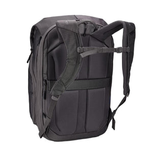 Dark grey 26L travel backpack by Thule, shown from the back with padded shoulder straps and mesh panel.