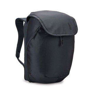 Dark grey travel backpack by Thule, with a sleek flap closure and visible shoulder strap, shown at an angle.