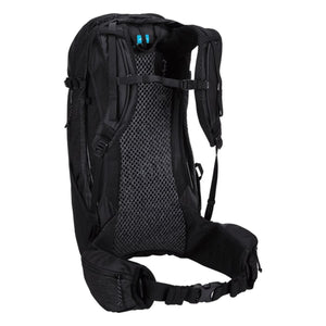 Black textured backpack by Thule featuring a breathable mesh back panel, adjustable straps, and hip belt, shown from the back.