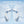 White and light blue foldable neck fan by Torras, showing blue-lit fans and air flow arrows.