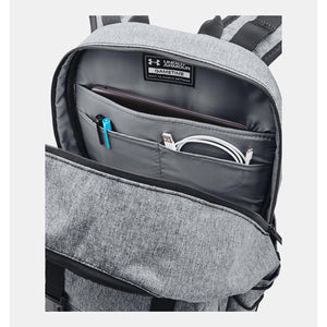 Grey heathered laptop backpack by Under Armour with an open main compartment, featuring an organized interior holding a tablet, pens, and charging cable.