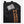 Black laptop backpack by Under Armour with an orange logo and a smartphone in a zippered front pocket, cropped view.