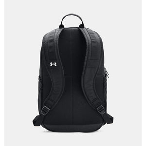 Black laptop backpack by Under Armour with white logo on mesh back panel and padded straps, seen from the back.