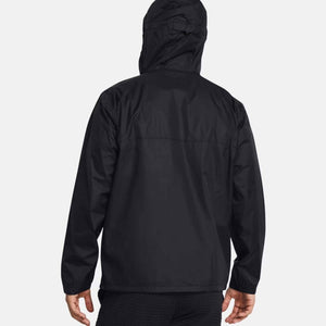 Black hooded men's jacket by Under Armour, shown from the back, worn with ribbed black pants.