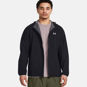 Black hooded Men's Stormproof Cloudstrike Stretch Jacket by Under Armour, with a white chest logo and grey interior lining, worn open over a light t-shirt.