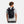 Black textured roll-top Summit Small Backpack by Under Armour with front bungee cords, worn on a person's back.