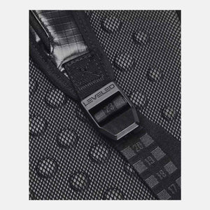 Black small backpack by Under Armour, a close-up showing mesh fabric with water droplets, a 'LEVELED' buckle, and crinkled material underneath.