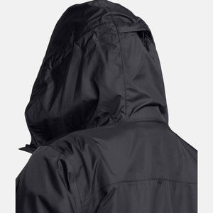 Black hooded jacket by Under Armour, back view, made of a smooth, slightly crinkled fabric with an adjustable hood.