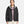 Black stormproof jacket by Under Armour featuring a white hood lining, a full front zip, and white 'H' logo.