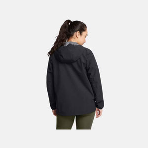 Black hooded jacket by Under Armour, shown from the back, worn with olive green leggings.