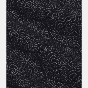 Black Women's Tactical Softshell Jacket by Under Armour with a swirling dotted line pattern.