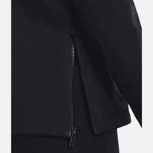 Black Women's Tactical Softshell Jacket by Under Armour, shown in a cropped close-up with a partially unzipped side vent.
