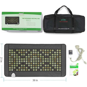 Infrared heating mat featuring a grid of jade and tourmaline stones by UTK Technology, with controller, carrying bag, and box, 21x38 inches.