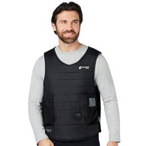 Black sleeveless quilted diving vest by Venture Heat featuring zippered pockets, a clear ID pocket, and a control panel, worn by a man in a grey long-sleeve shirt.