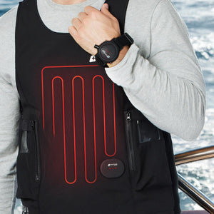 Black circular PRO V3 wrist remote controller by Venture Heat, with red lights on a velcro strap, worn on a man's wrist.