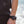 Black round wrist remote controller by Venture Heat with three red lights, worn on a person's wrist.