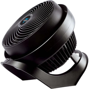 Black full-size whole room air circulator fan by Vornado, angled view showcasing its spiral front grill.