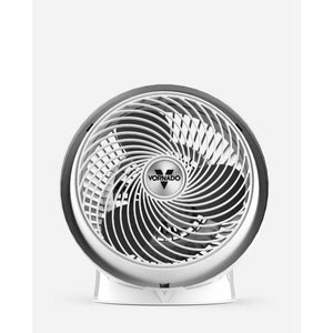 Polar white air circulator by Vornado with a chrome-like outer ring and swirling grill, front view.