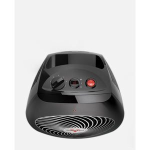 Black whole room heater by Vornado with a fan speed dial, heat settings, and red power button on top, showing a spiral grill on the front.